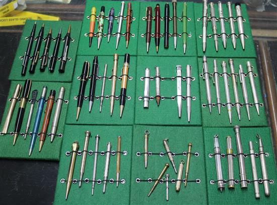 A collection of vintage propelling pencils in a tin case (57)